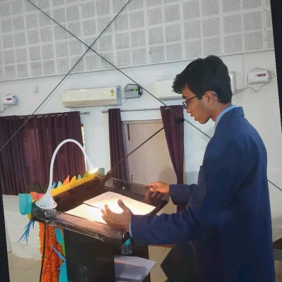 Salaj Shekhar speaking at a podium during a presentation